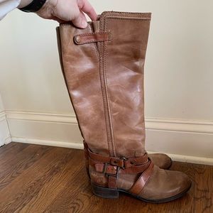 Brown leather Boot with strap details. Small heel